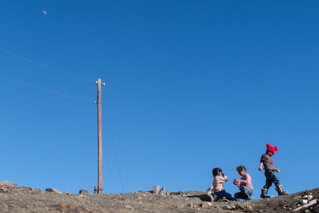 A group of people on a rocky hill

Description automatically generated